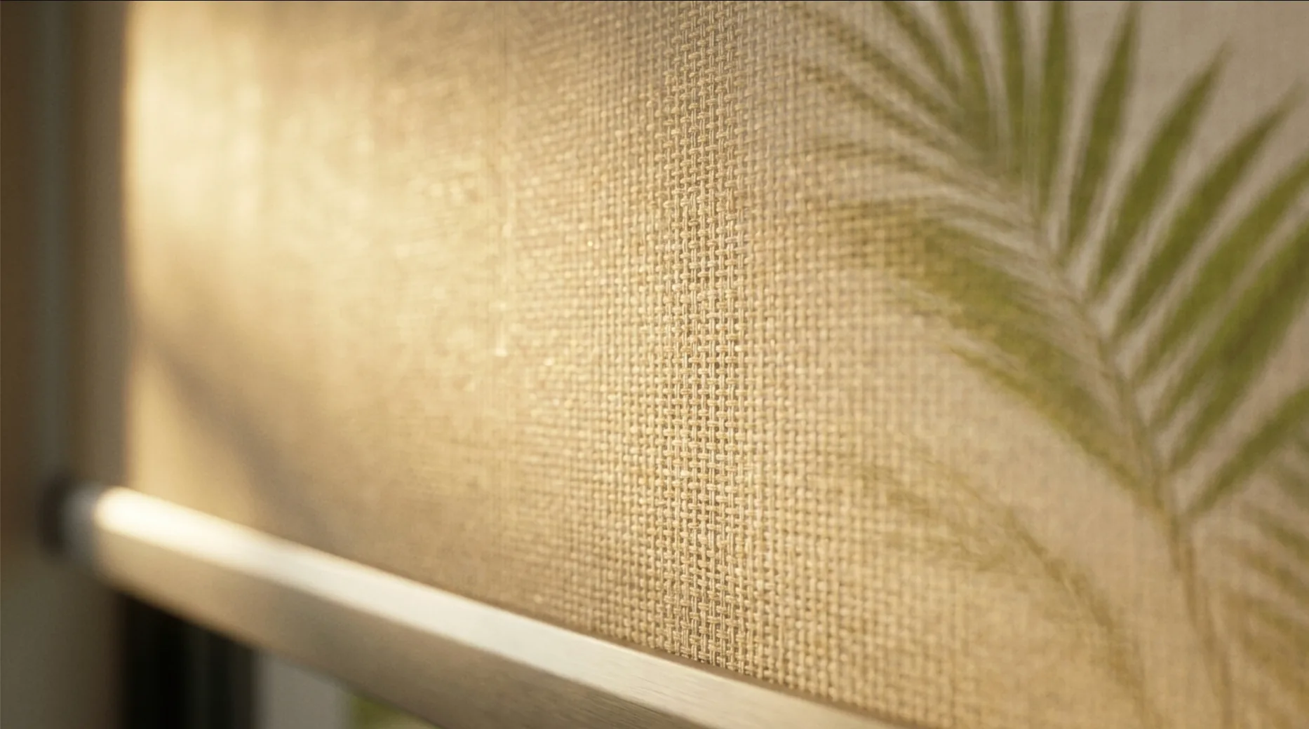 Detail of a woven solar shade fabric catching warm light
